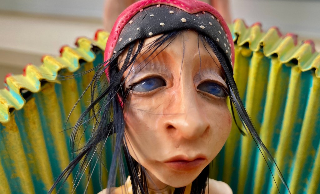 Couched in thoughts . . . mixed media figurative sculpture